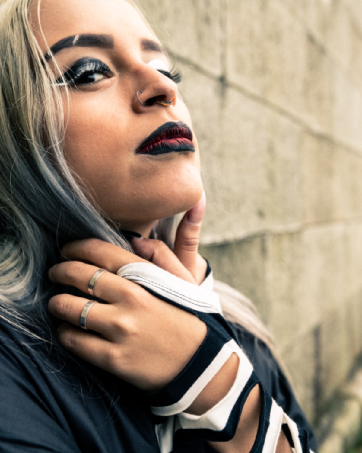 Close view of a woman applying mascara in soft daylight